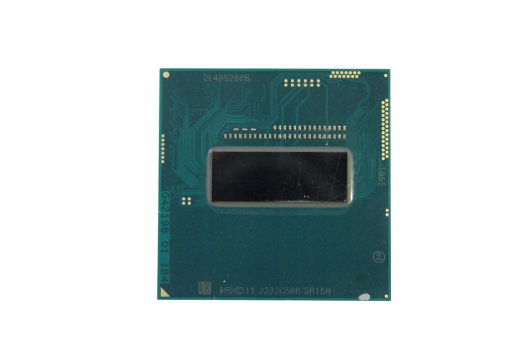 Procesor Intel Core i7-4700MQ | 4x 2.40 - 3.40 GHz | SR15H 1 Spód procesora Intel Core i7-4700MQ SR15H z widocznym rdzeniem i stykami